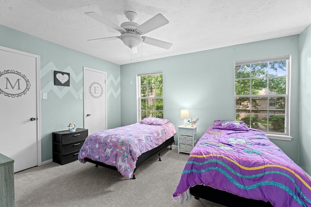 819 Maranon Ln, Houston, TX 77090 - bedroom with carpet, a textured ceiling, and a ceiling fan