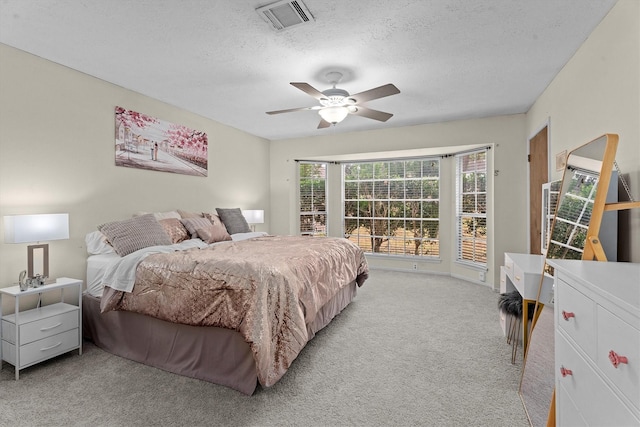819 Maranon Ln, Houston, TX 77090 - bedroom featuring light colored carpet, a textured ceiling, and ceiling fan