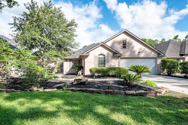 51 Eagle Mead Pl, The Woodlands, TX 77382 - view of front of property with brick siding, concrete driveway, and a garage