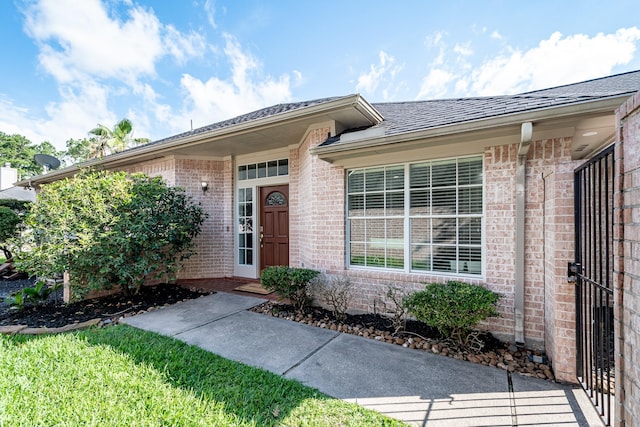 51 Eagle Mead Pl, The Woodlands, TX 77382 - doorway to property featuring brick siding