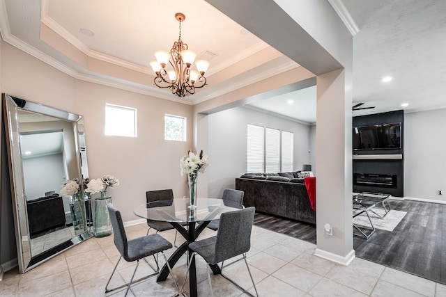 51 Eagle Mead Pl, The Woodlands, TX 77382 - dining space with ornamental molding, a chandelier, light tile patterned flooring, recessed lighting, and baseboards