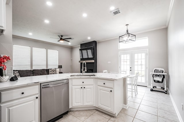 51 Eagle Mead Pl, The Woodlands, TX 77382 - kitchen with stainless steel dishwasher, a sink, light tile patterned floors, a ceiling fan, and recessed lighting