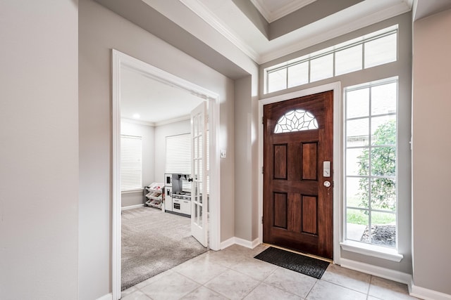 51 Eagle Mead Pl, The Woodlands, TX 77382 - foyer entrance with crown molding, light tile patterned flooring, baseboards, and light carpet