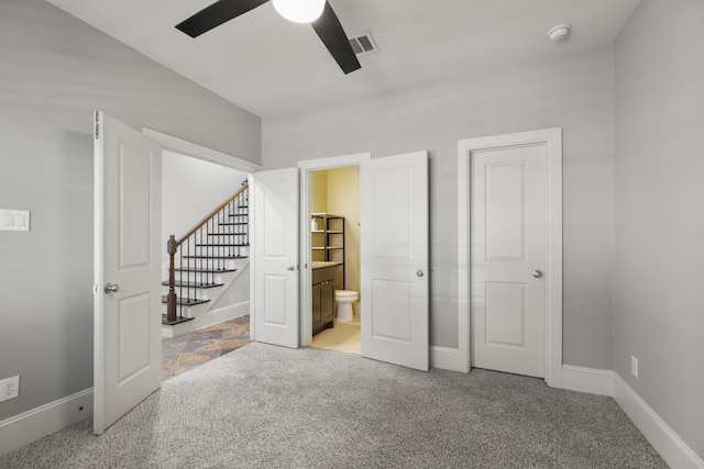 1407 Patterson St, Houston, TX 77007 - unfurnished bedroom with light carpet, baseboards, connected bathroom, and a ceiling fan