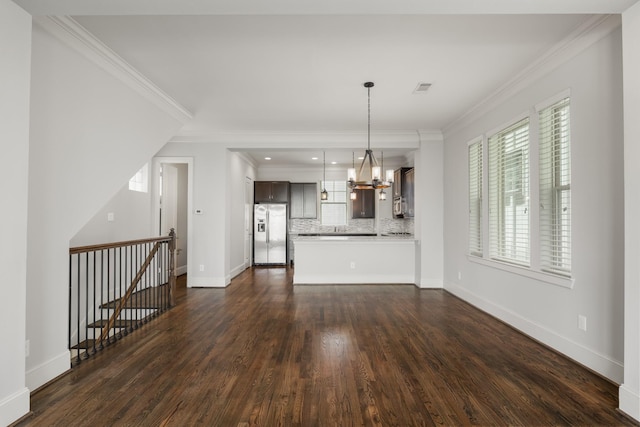 1407 Patterson St, Houston, TX 77007 - unfurnished living room with dark wood-style floors, crown molding, a chandelier, baseboards, and recessed lighting