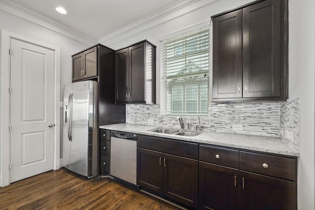 1407 Patterson St, Houston, TX 77007 - kitchen featuring appliances with stainless steel finishes, a sink, ornamental molding, tasteful backsplash, and dark wood-style floors