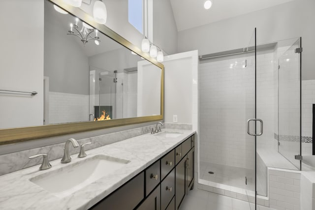 1407 Patterson St, Houston, TX 77007 - full bath featuring double vanity, a stall shower, vaulted ceiling, and tile patterned floors