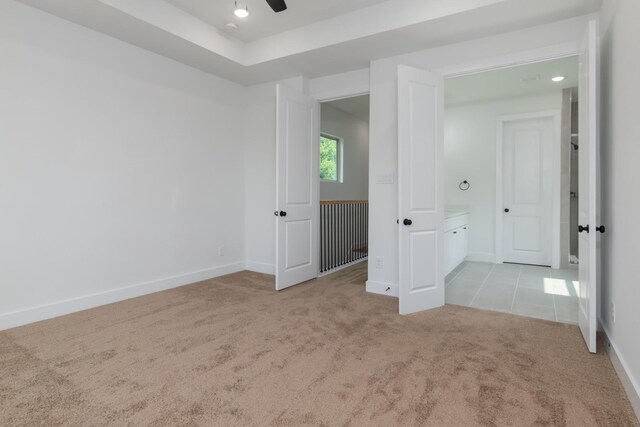 1411 E 34th St, Houston, TX 77022 - empty room featuring carpet flooring, a ceiling fan, and baseboards