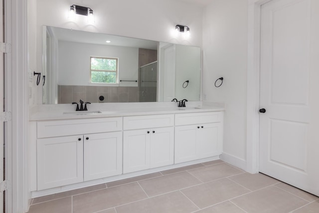1411 E 34th St, Houston, TX 77022 - full bath with a stall shower, tile patterned floors, and double vanity