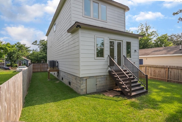 1411 E 34th St, Houston, TX 77022 - rear view of property with entry steps and french doors