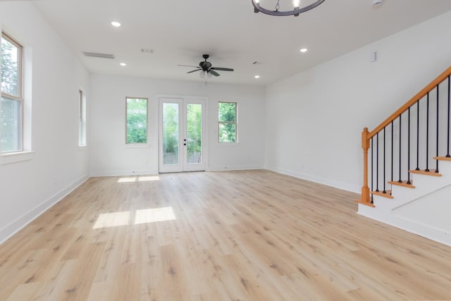 1411 E 34th St, Houston, TX 77022 - unfurnished living room with light wood-type flooring, a ceiling fan, stairs, recessed lighting, and baseboards