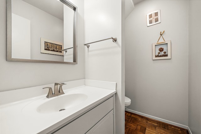 6417 Olympia Dr Unit 144, Houston, TX 77057 - bathroom with toilet, vanity, and baseboards