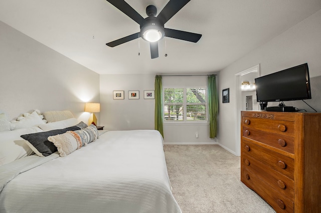 6417 Olympia Dr Unit 144, Houston, TX 77057 - bedroom featuring light colored carpet, a ceiling fan, and baseboards