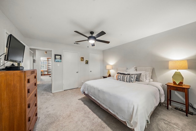 6417 Olympia Dr Unit 144, Houston, TX 77057 - bedroom featuring light colored carpet and a ceiling fan
