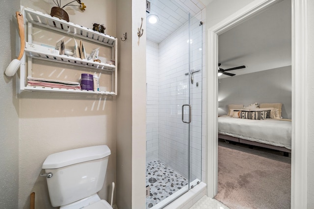 6417 Olympia Dr Unit 144, Houston, TX 77057 - full bath with ensuite bath, a stall shower, toilet, and a ceiling fan