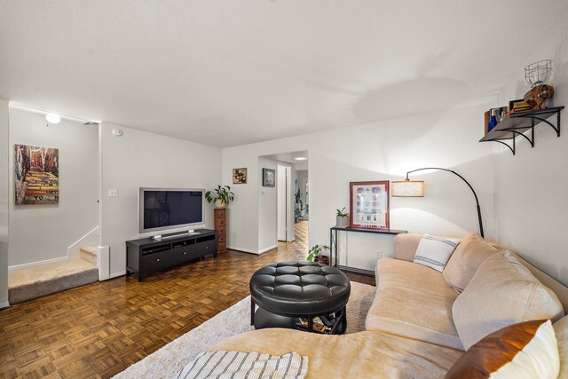 6417 Olympia Dr Unit 144, Houston, TX 77057 - living room with baseboards and stairs