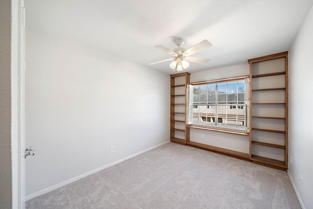 6417 Olympia Dr Unit 144, Houston, TX 77057 - carpeted empty room with a ceiling fan and baseboards