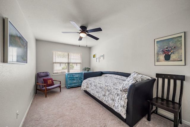 6417 Olympia Dr Unit 144, Houston, TX 77057 - carpeted bedroom featuring baseboards and ceiling fan