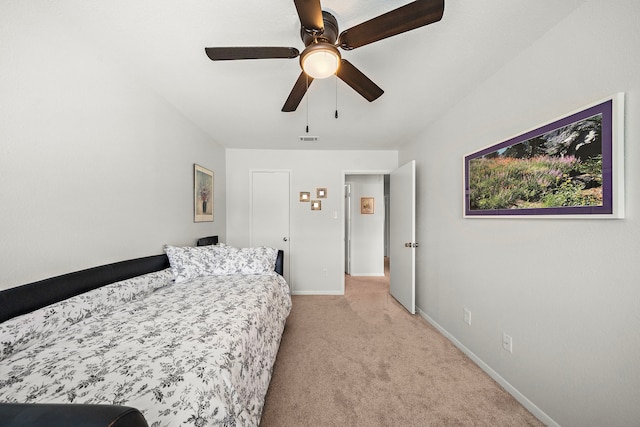 6417 Olympia Dr Unit 144, Houston, TX 77057 - bedroom featuring light carpet, baseboards, and ceiling fan