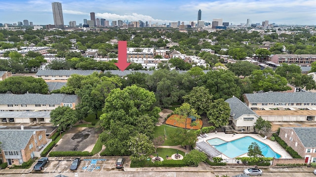 6417 Olympia Dr Unit 144, Houston, TX 77057 - drone / aerial view of skyline and a pool