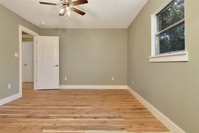 1105 W Dr, Port Neches, TX 77651 - spare room featuring ceiling fan, light wood-type flooring, and baseboards
