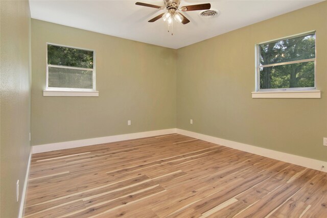 1105 W Dr, Port Neches, TX 77651 - unfurnished room featuring ceiling fan, wood finished floors, and baseboards