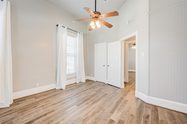 1318 Bingham St, Houston, TX 77007 - unfurnished bedroom with light wood-style floors, baseboards, and ceiling fan