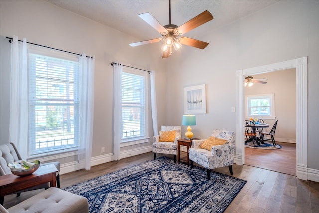 1318 Bingham St, Houston, TX 77007 - sitting room featuring a ceiling fan, wood finished floors, baseboards, and lofted ceiling