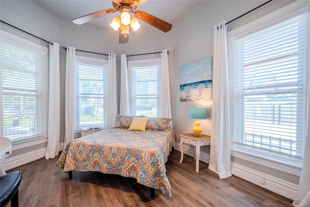 1318 Bingham St, Houston, TX 77007 - bedroom featuring wood finished floors, baseboards, and ceiling fan