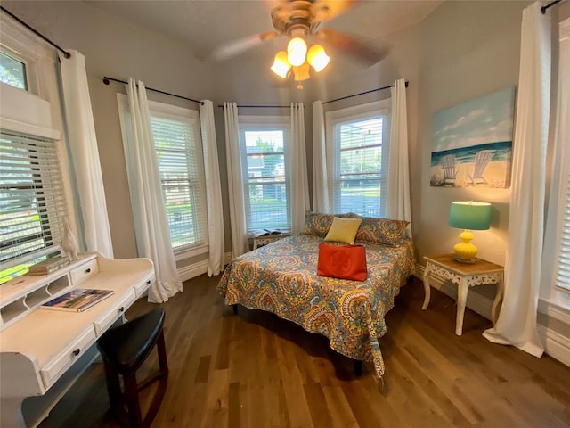1318 Bingham St, Houston, TX 77007 - bedroom featuring dark wood-type flooring, a ceiling fan, a desk, and baseboards