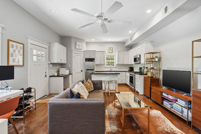 1409 Tulane St, Houston, TX 77008 - living room with a ceiling fan, wood finished floors, and recessed lighting