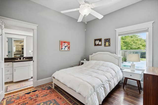 1409 Tulane St, Houston, TX 77008 - bedroom featuring a sink, dark wood finished floors, baseboards, and ceiling fan