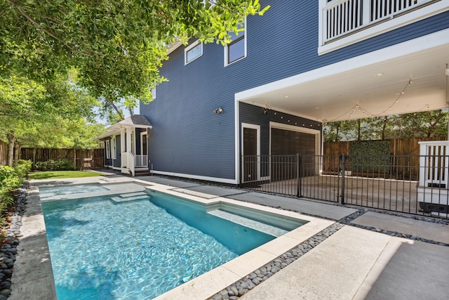 1409 Tulane St, Houston, TX 77008 - view of swimming pool with a patio area, a fenced backyard, and a pool with connected hot tub