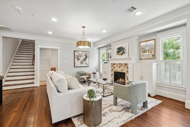 1409 Tulane St, Houston, TX 77008 - living room with stairway, a tile fireplace, healthy amount of natural light, ornamental molding, and dark wood-style flooring