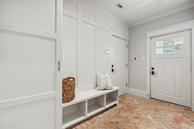 1409 Tulane St, Houston, TX 77008 - mudroom featuring brick flooring and ornamental molding