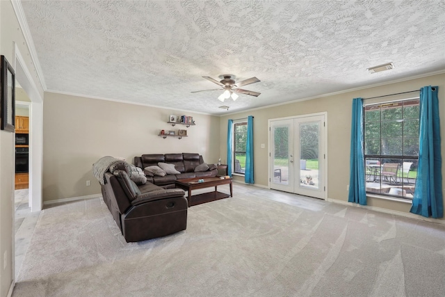 517 Hillebrandt, Beaumont, TX 77705 - carpeted living area with plenty of natural light, ornamental molding, french doors, ceiling fan, and baseboards