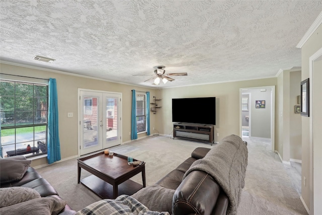 517 Hillebrandt, Beaumont, TX 77705 - living room featuring light colored carpet, french doors, ceiling fan, baseboards, and crown molding