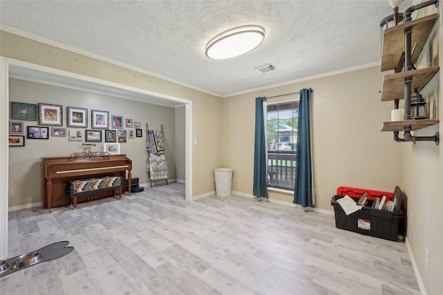 517 Hillebrandt, Beaumont, TX 77705 - interior space with a textured ceiling, wood finished floors, ornamental molding, and baseboards