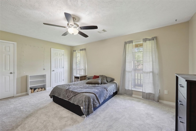 517 Hillebrandt, Beaumont, TX 77705 - bedroom with carpet floors, a textured ceiling, ceiling fan, and baseboards