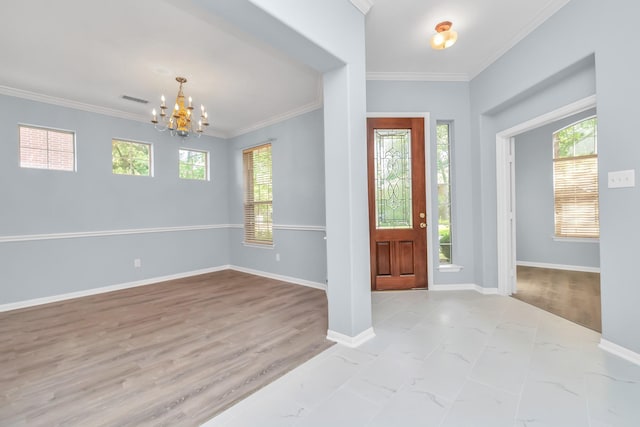 19 Long Springs Pl, The Woodlands, TX 77382 - entrance foyer featuring a chandelier, healthy amount of natural light, ornamental molding, baseboards, and marble finish floors