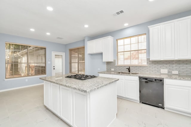 19 Long Springs Pl, The Woodlands, TX 77382 - kitchen with dishwashing machine, light marble finish floors, a sink, recessed lighting, and gas stovetop
