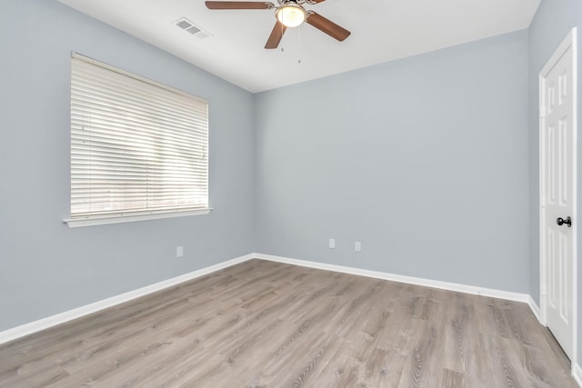 19 Long Springs Pl, The Woodlands, TX 77382 - empty room with a ceiling fan, wood finished floors, and baseboards