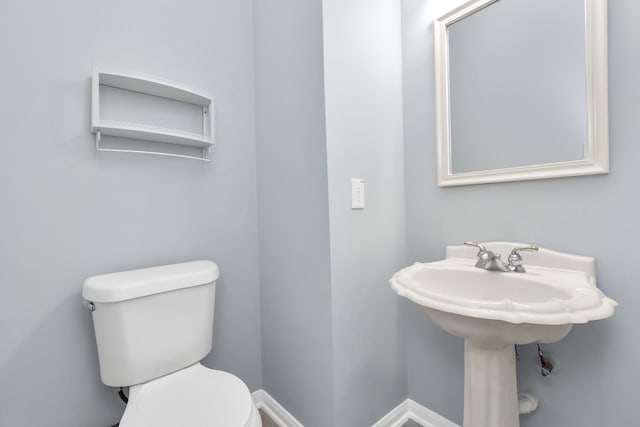 19 Long Springs Pl, The Woodlands, TX 77382 - half bathroom with toilet and a sink