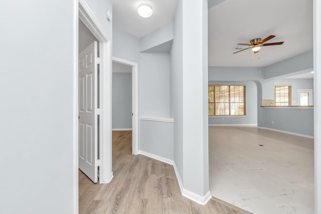 19 Long Springs Pl, The Woodlands, TX 77382 - corridor with baseboards and wood finished floors