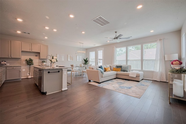 2923 Laurel Mill Way, Houston, TX 77080 - living room featuring plenty of natural light, dark wood-type flooring, recessed lighting, ceiling fan, and a chandelier