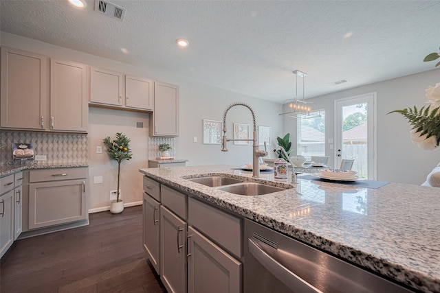 2923 Laurel Mill Way, Houston, TX 77080 - kitchen with stainless steel dishwasher, a sink, gray cabinetry, light stone countertops, and dark wood-style floors