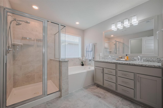 2923 Laurel Mill Way, Houston, TX 77080 - full bath with double vanity, a shower stall, a bath, and recessed lighting