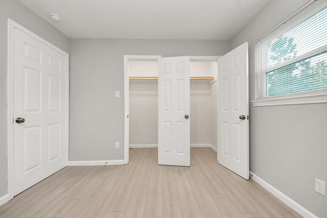 3030 Dacca Dr, Houston, TX 77051 - unfurnished bedroom with light wood-type flooring and baseboards