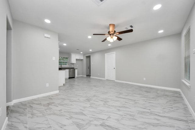 3030 Dacca Dr, Houston, TX 77051 - unfurnished living room featuring light marble finish floors, ceiling fan, recessed lighting, and baseboards