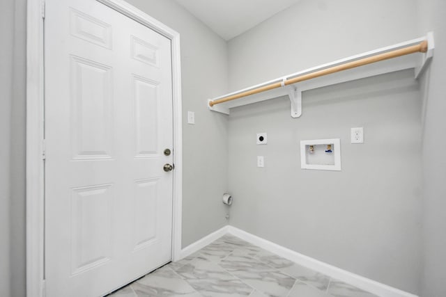 3030 Dacca Dr, Houston, TX 77051 - laundry area featuring electric dryer hookup, light marble finish floors, washer hookup, and baseboards